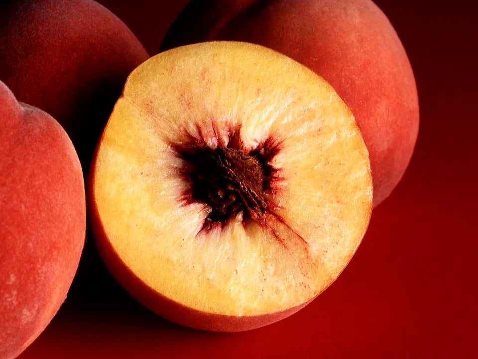 Fresh peaches representing peach pouch flavor