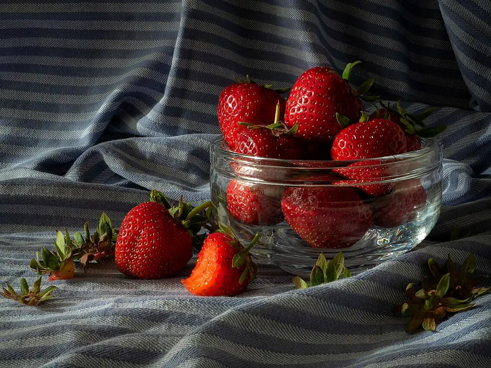 Fresh strawberries representing strawberry pouch flavor